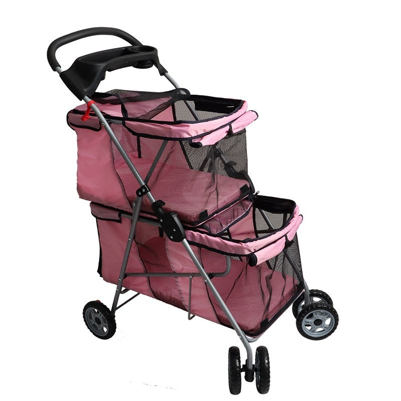 Pink pet stroller with black handle and wheels on a white background