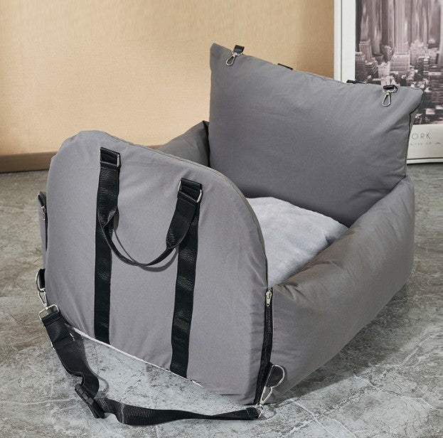 Gray bean bag chair with straps on a tiled floor.