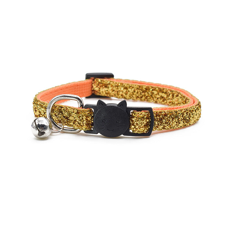 Yellow glitter cat collar with black bell and cat-shaped tag on a white background
