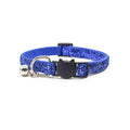Blue glittery cat collar with a bell and black cat-shaped tag on a white background