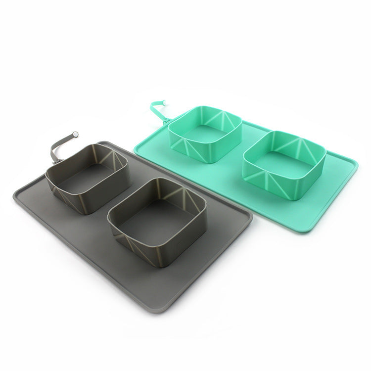 Gray and green silicone pet feeding mats with two square compartments and corner hanging loops.