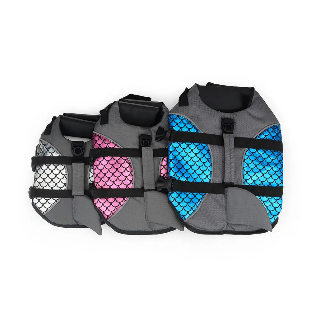 a silver, pink and blue pet life jacket on a white bakground