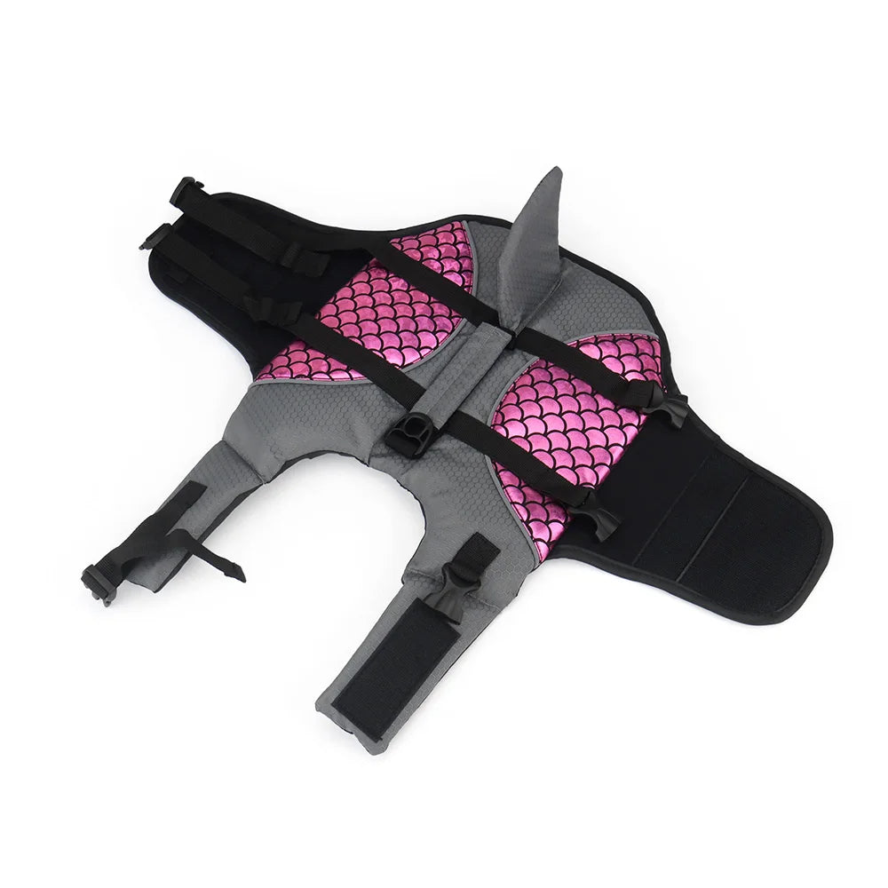 a pinl pet life jacket opened out flat on a white background