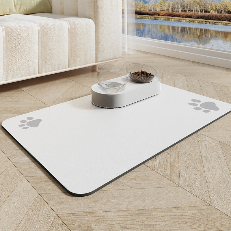 Pet mat with paw prints on a wooden floor in a living room setting.