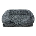 Fluffy black pet bed on a white background