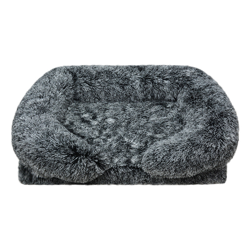 Fluffy black pet bed on a white background