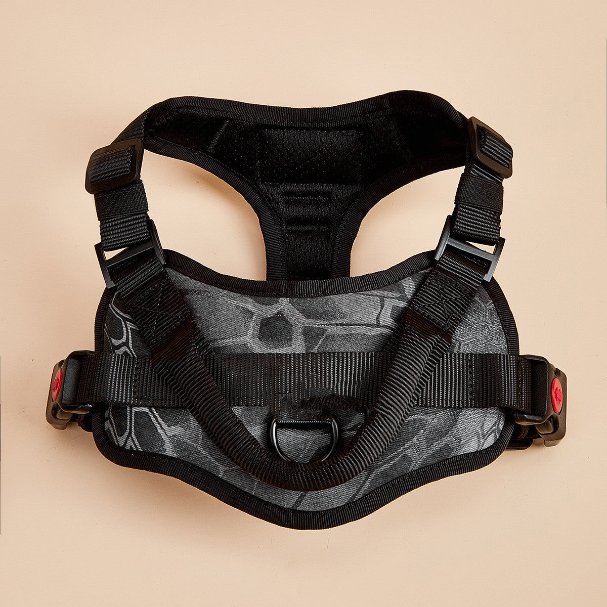 Black and gray tactical vest on a beige background
