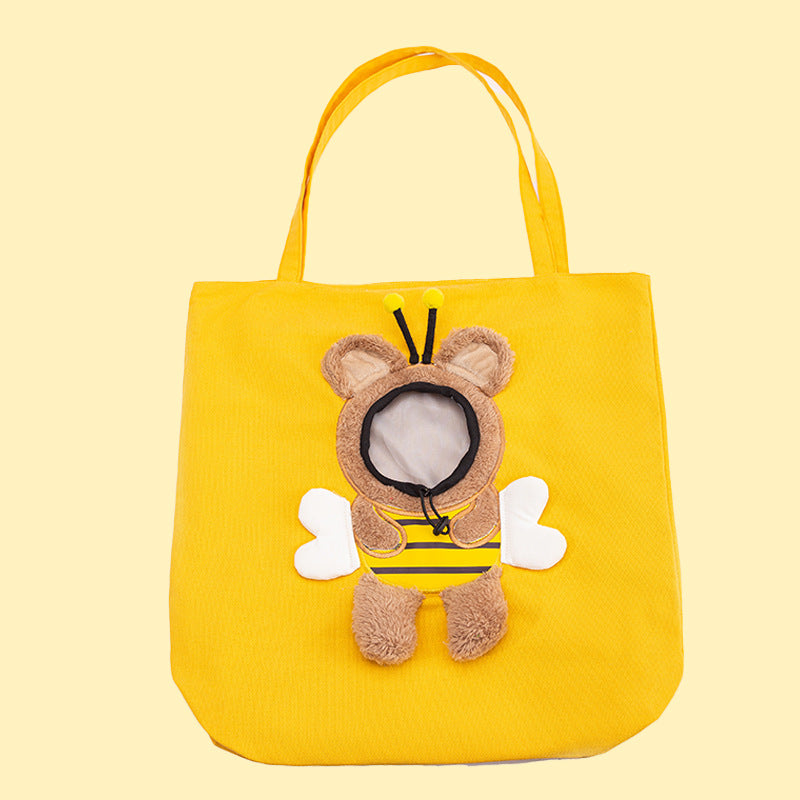 Yellow tote bag with a bee-themed plushie on a light yellow background
