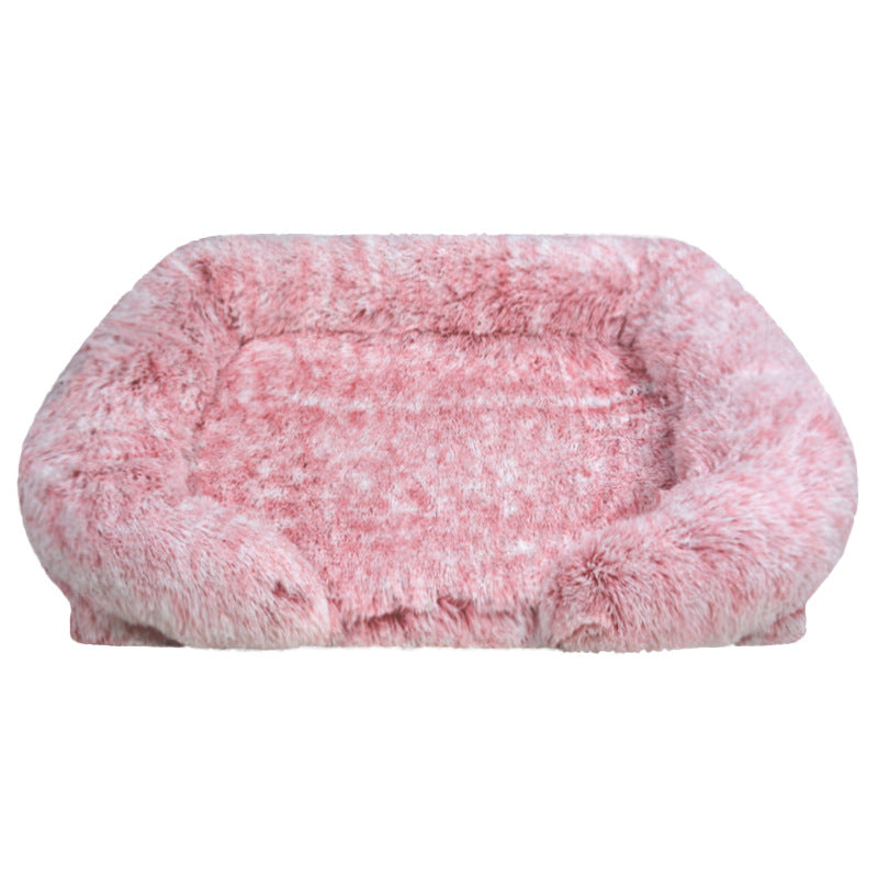 Pink fluffy pet bed on a white background