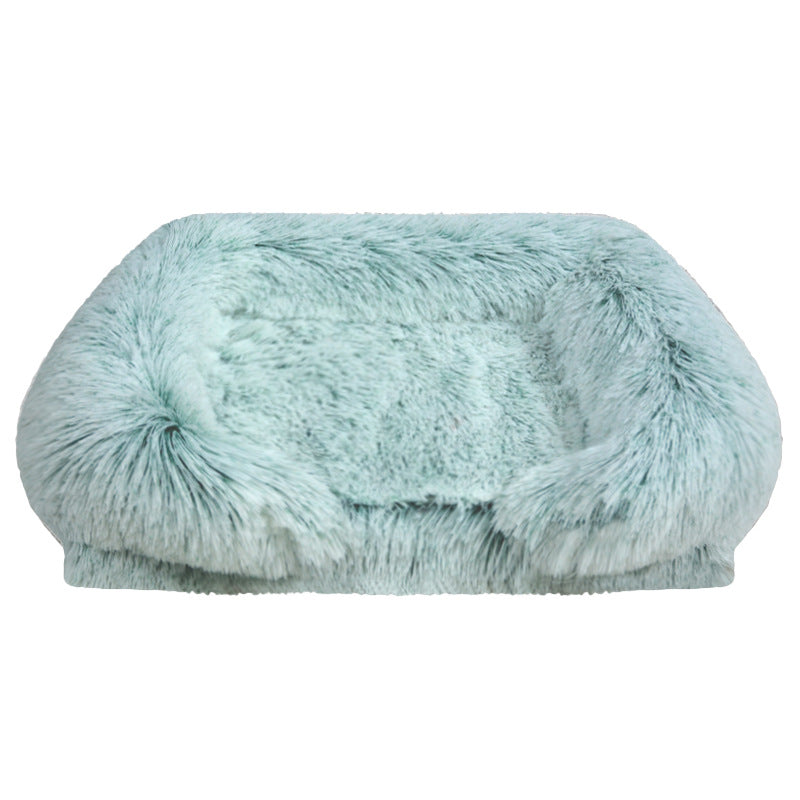 Green fluffy pet bed on a white background