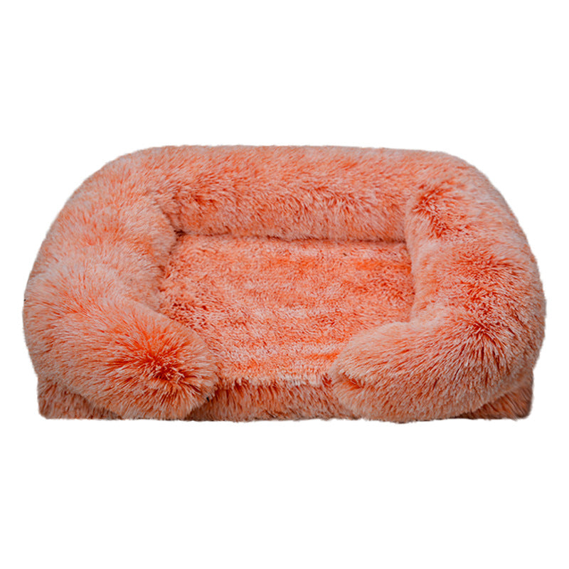 Fluffy orange pet bed on a white background