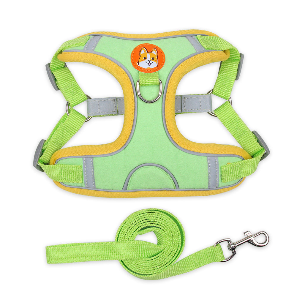 Green dog harness with yellow accents and a matching leash on a white background