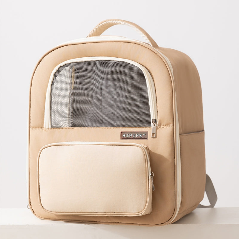 Beige pet carrier backpack with mesh window on a light gray background